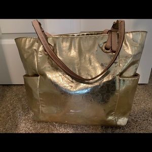 Micheal Kors gold tone purse
